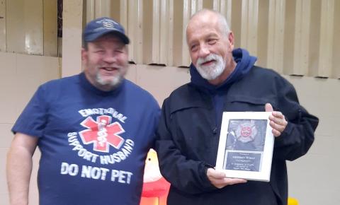 At a recent celebration, Ranger firefighter Geoffrey Wells was awarded for five years of faithful service by Chief Mike Taylor. George Stewart was awarded for 10 years of service but is not shown.