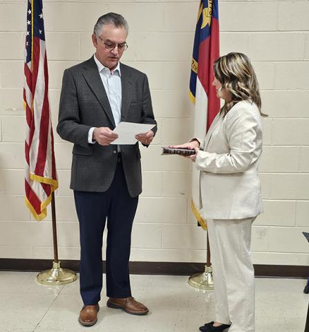 Newly elected Andrews Alderwoman Chasity Ledford is sworn in by state Rep. Karl Gillespie (left) at the Dec. 11 meeting of the board. Ledford was also approved as mayor pro tempore as the highest vote-getter, in keeping with the town’s tradition.