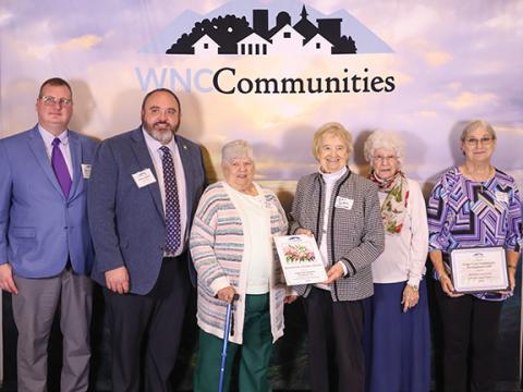 Sarah LeeAnn Photography Southwestern Commission Chair Tim Radford, presenter Josh English with Wells Fargo, Nancy Helms, Joan Dockery, Betty Hedrick and Robin Johnson, president of the Grape Creek Community Development Club (from left), accept a Mountain Laurel Best in Class Award.