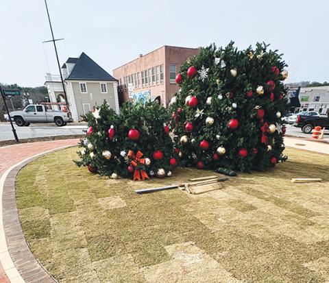 Photos by Randy Foster/editor@cherokeescout.com The Town of Murphy is keeping a close eye on the weather for this Friday’s Christmas tree lighting and Saturday’s Christmas parade. As of Monday, there was a good chance of rain on both days. Both events are still planned to take place as scheduled, but town officials will make final decisions by noon the day before each event. The tree lighting takes place on the northeast corner of the downtown traffic circle, shown in this photo taken from a second-floor wi