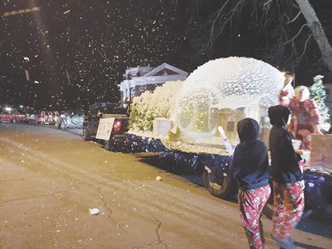 Photos by Anngee Quinones Belian/Staff Correspondent: ReMax Town & Country won best overall during the annual Murphy Christmas Parade on Saturday night through downtown. Folks were picking their viewing spots prior to the start, and their excitement was obvious from Andrews Road to Valley River Avenue. 