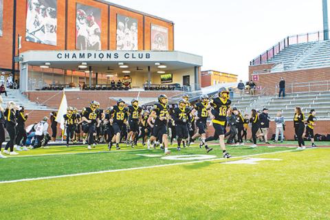 Cannon Crompton/sports@cherokeescout.com The Murphy varsity football team takes the field at Lenoir-Rhyne University in Hickory on Saturday for the state 2A championship game. The Bulldogs lost a hard-fought game to defending state champion Tarboro. Story and photos, page 1B.