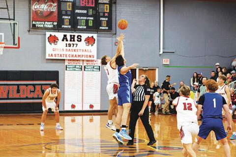 Cannon Crompton/sports@cherokeescout.com Gabe Clark (left) of Andrews and Dalton Kester (right) of Hiwassee Dam jump for the ball at the start of the game on Nov. 25. 
