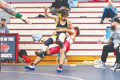 Cannon Crompton/sports@cherokeescout.com Chase Beasley (red and white singlet) of Andrews goes for a suplex on Josiah Niebla (black and gold singlet) of Murphy in their match on Nov. 26.