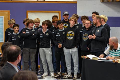 Photos by Cannon Crompton/sports@cherokeescout.com Three local teams were honored during Thursday’s meeting of the Cherokee County Board of Education for their achievements during the fall sports season. Murphy High School varsity boys soccer head coach Andrew Zenobi (right) speaks on the Bulldogs’ Smoky Mountain Conference-winning season that ended in the third round of the state 2A playoffs.