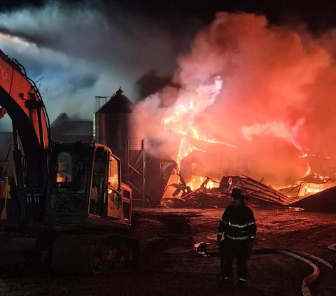 An intense fire destroyed one of eight chicken barns at Andrews Valley Poultry Farm on Friday night. Photo by Kevin Carter, Cherokee County fire marshal