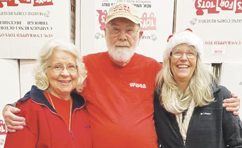 Susie and John Evans and their daughter, Barbara, stay busy helping others, including being active with Cherokee County’s Toys for Tots program.