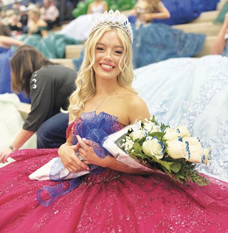 The 2025-26 Hiwassee Dam High School homecoming queen, Brooklyn Orton, proudly wears the tiara presented to her Friday night by last year’s homecoming queen, Ally Ledford. See the full court on page 12A.