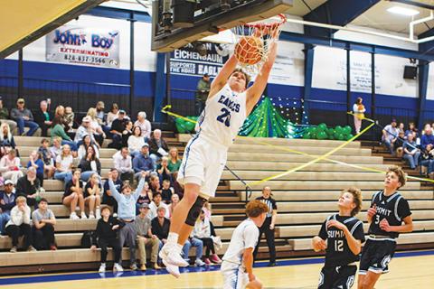 Cannon Crompton/sports@cherokeescout.com Jonah Dockery of Hiwassee Dam slams home a dunk against Summit Charter on Jan. 16.