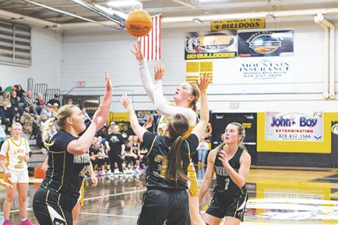 Cannon Crompton/sports@cherokeescout.com Emma Laney of Murphy takes a shot through traffic against Hayesville on Jan. 20. 