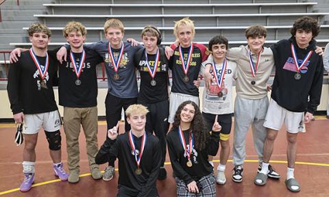 Mike Catuto/Contributing Photographer The Murphy varsity wrestling team proudly wears its medals at the Smoky Mountain Conference tournament Thursday. Back row (from left): Anthony Catuto, Brody McFaddin, Branson Crocker, Brodi Haines, James Garrett, Lucas Castell, Josiah Niebla and Braden Edwards. Front row (from left): Weston Adams and Ivy Werner.