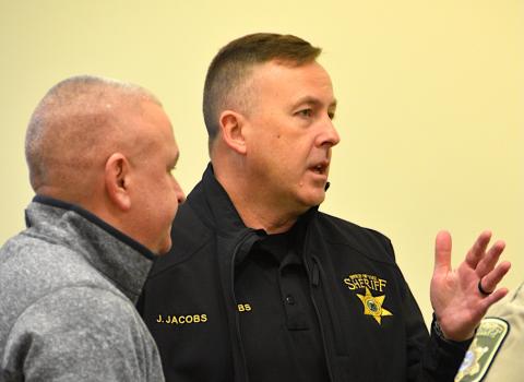 Justin Jacobs, right, chief deputy of the Cherokee County Sheriff's Office, will fill in for former sheriff Dustin Smith, who resigned effective Friday. At left is Chris Wood, who is running for sheriff in the March GOP primary. About a dozen people attended Saturday's special called meeting of the board of commissioners.