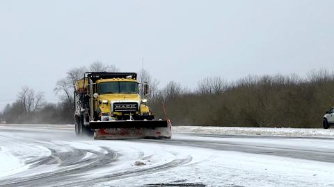 An N.C. Department of Transportation snow plow makes another pass on U.S. 19/74/129 between Andrews and Marble on Saturday afternoon.
