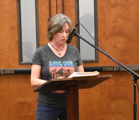 Randy Foster/editor@cherokeescout.com Cherokee County resident Katherine Taaffe gives remarks ahead of presenting a petition to Cherokee County commissioners calling for them to protect public lands from private development at Monday night’s board of commissioners meeting.