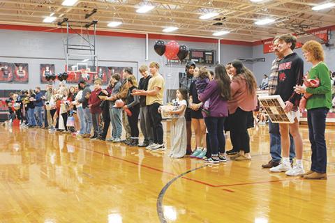  Cannon Crompton/sports@cherokeescout.com Andrews High School honored winter sports student-athletes before Friday night’s basketball games. Joined by their families are seniors (from left) Alexis Beasley, Jaden Crocker, Rileigh LeQuire, Jay C Palmer, Isaac Patrick, Chanteah Rattler and Logan Shuler.