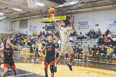 Cannon Crompton/sports@cherokeescout.com Cale Harger of Murphy goes up for a shot against Rosman on Jan. 28.