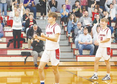 Cannon Crompton/sports@cherokeescout.com Andrews junior Gabe Clark celebrates after draining a shot for the 1,000th point in his high school basketball career. Clark scored 11 seconds into the game on Feb. 11. The last Wildcat to reach the 1,000-point milestone was Gabe’s brother, Ty Clark, who achieved it during his senior year last season.
