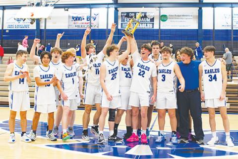 Cannon Crompton/sports@cherokeescout.com The Hiwassee Dam boys varsity basketball team won the Little Smoky Mountain Conference tournament Thursday night. From left are Maverick Hawley, Oscar Page, Jesse Raper, Abel Penland, Ben Loudermilk, Aiden Weaver, Jonah Dockery, Pace Ware, Brock Orton, Dalton Kester, Jimmy Kelly, Braden Trow and Avery Taylor. 