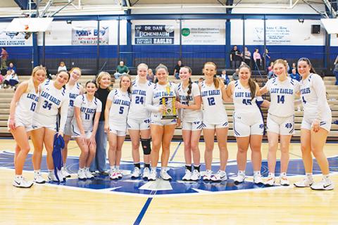 Cannon Crompton/sports@cherokeescout.com The Hiwassee Dam girls varsity basketball team won the Little Smoky Mountain Conference tournament on Thursday. From left are Brooklyn Orton, Sophia Gibson, Dailyn Stiles, Ryleigh Harris, Adysonn Wooten, Leah Taylor, Kinley Stiles, Avery McNabb, Abby Harris, Peyton Williamson, Sarah Stock, Alyssa Standridge and Brinkley Payne.