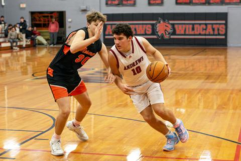 Cannon Crompton/sports@cherokeescout.com Brady Queen of Andrews drives past a Rosman defender on Jan. 22.