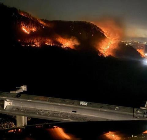 100 acres: While the Winding Stairs Alpha Fire was 50% contained as of Feb. 11, flames were still burning all too close to vehicles traveling on U.S. 64.