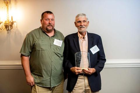 Johnny Shields (right) was honored by the N.C. Grange at the 2025 Farmer of the Year awards ceremony in Raleigh. He placed third in the state. At left is Jamie Lance. Shields and Lance are both supervisors with the Cherokee County Soil & Water Conservation District.