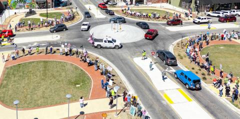 A drone-shot image of the traffic circle in downtown Murphy shows a No Kings rally with Trump Train participants Saturday afternoon. Michelle Bradbeer/Staff Correspondent