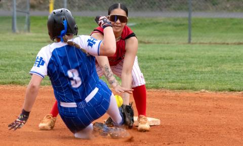 Avery McNabb (No. 3) of Hiwassee Dam slides into second base as Chanteah Rattler of Andrews tries to make the tag on Friday.