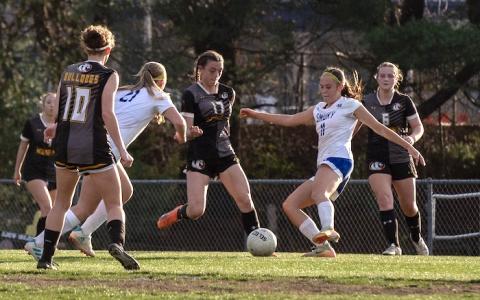 Kadence Walton (No. 17) of Murphy kicks the ball past Smoky Mountain defenders Thursday.
