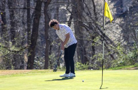 Brady Queen putts at Mountain Harbour Golf Club on March 19.