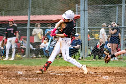 Dawson Stalcup of Andrews gets a hit against Rosman on March 10. 