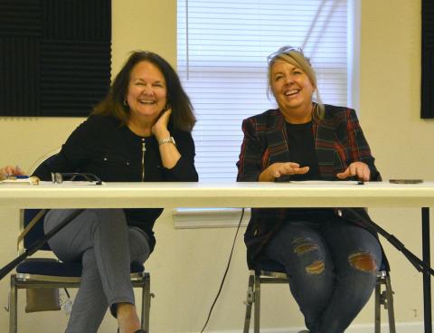 Sue Lynn Ledford (left) and Jeana Conley react to the decision by the Cherokee County Republican Party Executive Committee to recommend the two to fill vacancies on the board of commissioners Monday night.