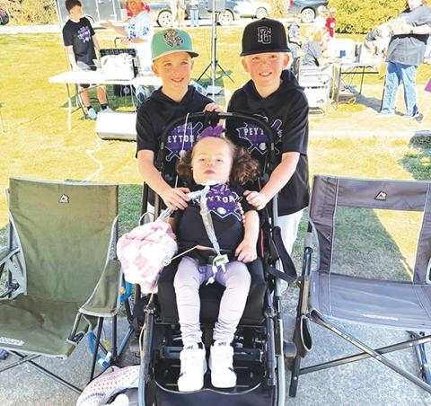 Photos by Aiden McCoy Williams/Staff Correspondent Peyton Mixon (middle) was able to attend the Home Run Derby held Saturday to raise funds for her and her family.