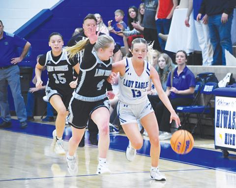 Lexie Anderson/The Graham Star Brooklyn Orton of Hiwassee Dam dribbles down the court against Robbinsville on Monday night.