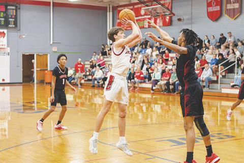 Cannon Crompton/sports@cherokeescout.com Logan Shuler of Andrews hits a jump shot against Winston-Salem Preparatory Academy on Saturday. 