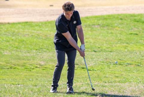 Brody Orton of Murphy chips the ball at Mountain Harbour Golf Club in Hayesville on March 19.