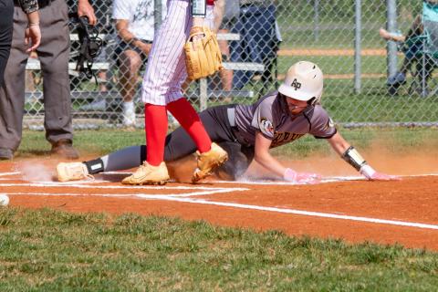 Emma Hensley of Murphy slides safely into home plate to score against Andrews on April 14.