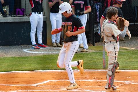 Dawson Stalcup of Andrews scores the first run of the game against Hayesville on Thursday.