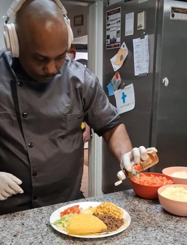 Johnny Walker, assistant manager of the Hurlburt-Johnson Friendship House homeless shelter, enjoys preparing meals for others through a new program he started called Murphy Meals.