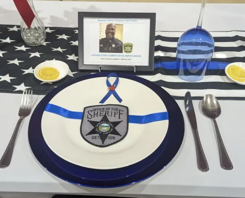 A dinner setting was laid out for Cherokee County Detention Sgt. Francisco Flattes, who died in the line of duty in June 2025.