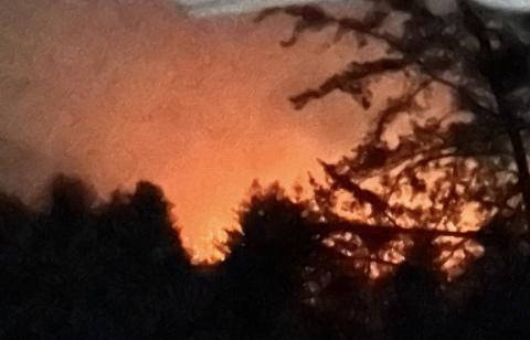 Handle with care: Smoke hangs over the mountains around 8:20 p.m. March 24 in Beaver Dam. “It was scary to see how fast the fire grew, but they handled it quickly,” one resident said.