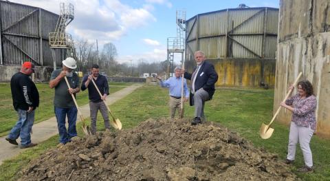 Nicole Wright/Staff Correspondent  Attendees at the March 23 groundbreaking ceremony for the Andrews wastewater treatment facility project included (from left) Andrews Alderman James Mclean, facility director Tim Wood, construction superintendent from Haren Randell Knepper, McGill Senior Principal Joel Storrow, Andrews Mayor James Reid as king of the mountain and Claire Osborn from the N.C. Department of Environmental Quality.