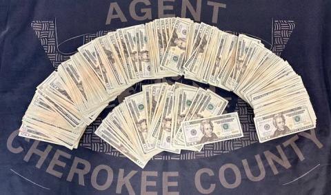 Money seized by law enforcement following a chase that resulted in two arrests.