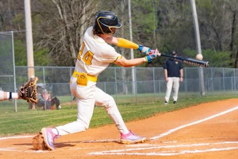 Aayden Williams of Murphy makes contact with the ball against Hayesville on April 2.