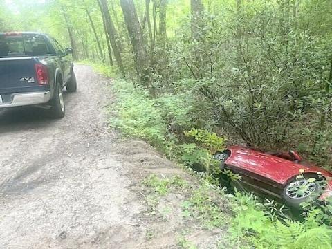 An elderly man lay trapped inside his vehicle on June 1, after it ran off a roadway and into the woods. Emergency responders quickly arrived at the scene.
