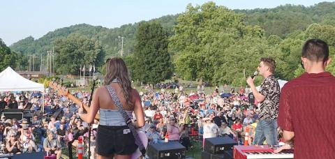 Braden Rumfelt, shown with microphone in his left hand, performs during a concert in Murphy on Friday. Photo by Bill Belian/Contributing photographer 