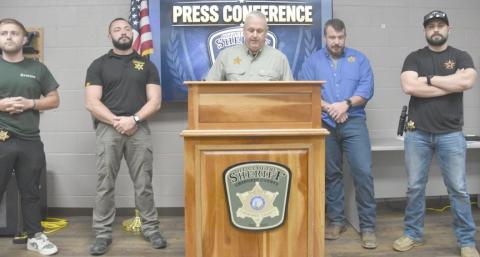 Cherokee County Sheriff Chris Wood, center, holds a news conference to announce a deputy-involved shooting in the Peachtree community on June 11. Flanking him are, from left, Narcotics Det. Parker Southard, Lt. Nathan Henderson, Lt. Drew Payne and Narcotics Agent Hunter Wood.