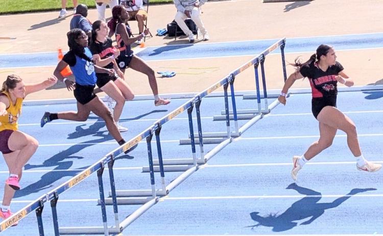 Kaiya Ellis (right) of Andrews leads the 1A girls 100-meter hurdles during the preliminary qualifying run on Thursday at N.C. A&T in Greensboro.
