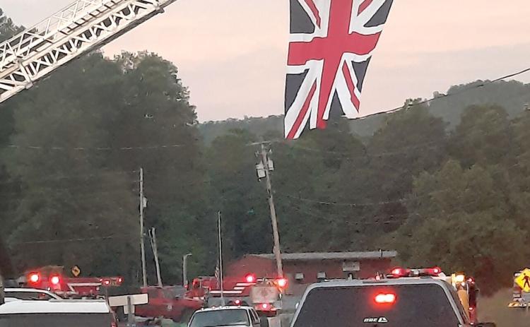 A ceremonial flag raising honored Alan Andrews who was born in London.