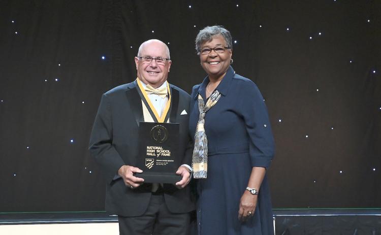 Legendary Murphy High School football coach David Gentry (left) was inducted into the National High School Hall of Fame on June 29 at the National Federation of State High School Associations Annual Summer Meeting in Salt Lake City, Utah. Gentry is joined by Que Tucker (right), the N.C. High School Athletic Association commissioner. Photo by Kim McIntosh/NFHS